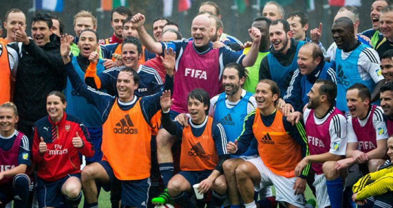 FIFA president Gianni Infantino (C) and his teammates pose for a photo after a FIFA Team Friendly Football Match at the FIFA headquarters yesterday in Zurich, Switzerland. (Photo by Philipp Schmidli/Getty Images)