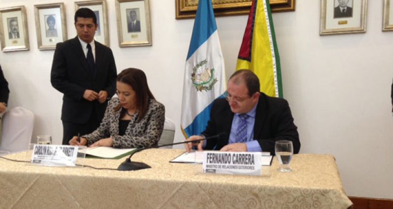 Foreign Ministers of Guyana and Guatemala signing agreement on political consultations
