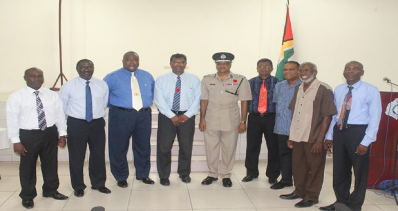 Public Security Minister Khemraj Ramjattan and Commissioner of Police Seelall Persaud pose with members of the foundation