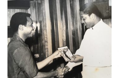 Flashback: Farrier presents a copy of his first published play to President Forbes Burnham. The design of the book cover was done by graphic artist and designer Bernard Ramsay.