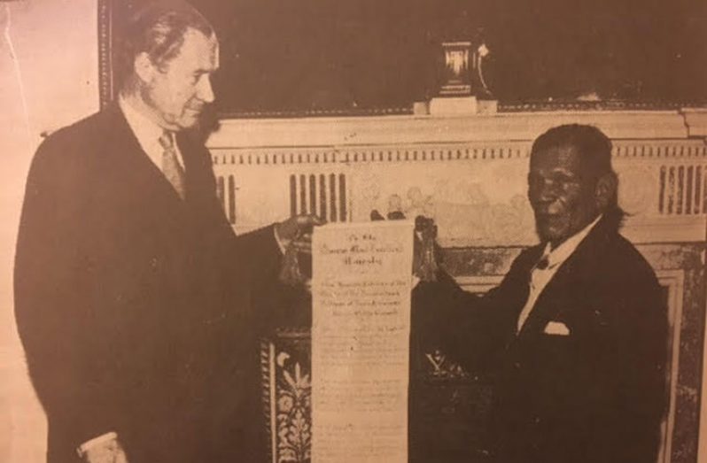 Hon. Stephen Esterban Campbell, MP, presenting the Amerindian Land Rights Petition to the British Secretary of State, Hon. Duncan Sandys, in London, England, in 1962, after the two had a one-hour-long meeting