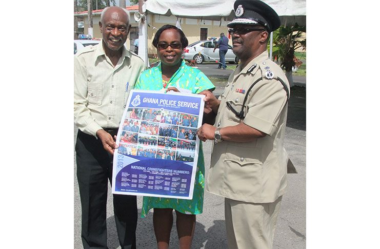Police Commissioner Leroy Brummell and his wife being presented with a Calender of the Ghana Police Service, which Farrier was given when he paid a courtesy call to The Ghana Police Service in Accra, Ghana in 2012.