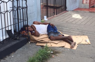 A destitute citizen sleeping on the Bourda Market pavement.
(Photo by Francis Q. Farrier)
