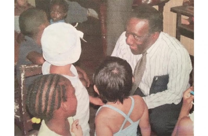 Former CARICOM Secretary General, Dr. Edwin
Carrington, on a visit with the children in Tiger Bay,
while he headed the CARICOM Secretariat