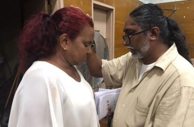 Fr. Godfrey Veersammy, SJ, gives a special blessing to one of the faithful who attended the Mass (Photo by Francis Quamina Farrier)