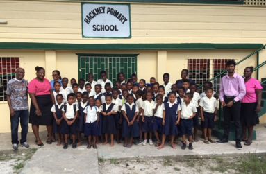 Farrier at left with teachers and students of the Hackney Primary School on the Pomeroon, Region Two, after a free poetry and storytelling session on November 9, 2018.