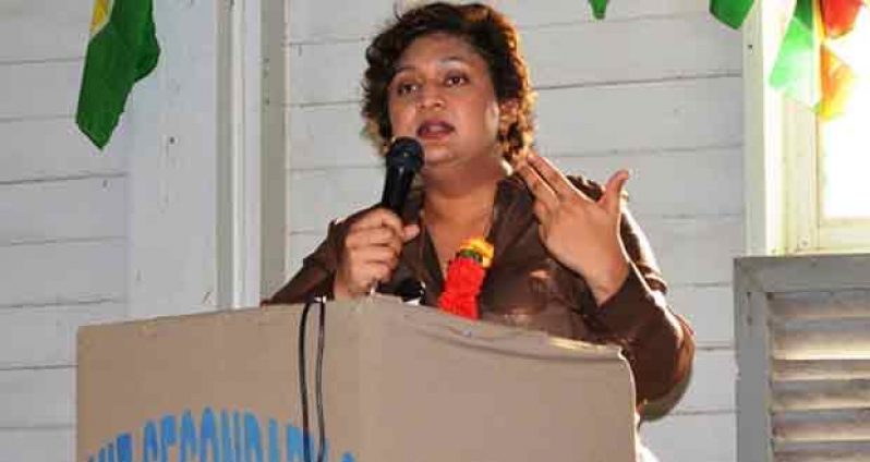 Minister of Education,  Priya Manickchand addressing the gathering at the Friendship Secondary School during the meeting. 