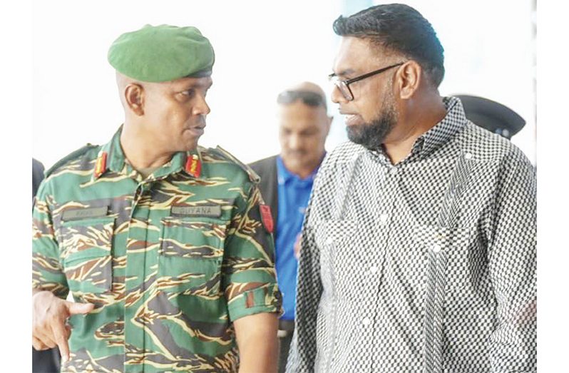 Commander in Chief of the Armed Forces, President Dr Irfaan Ali (right) engages Chief of Staff of the GDF, Brigadier Omar Khan (Office of the President photo)