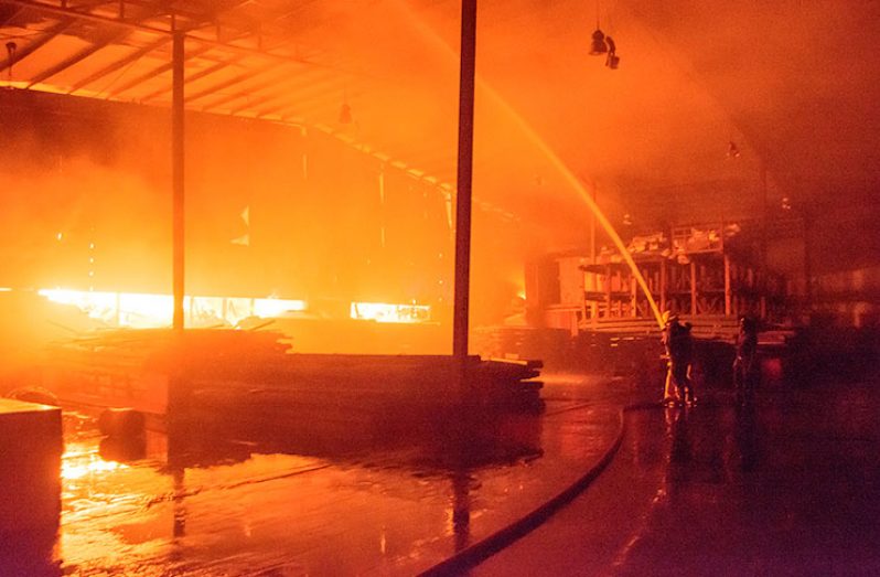 Firefighters battle to put out the blaze that started in
the company’s Houston Complex, East Bank Demerara
bond Monday evening (Samuel Maughn photo)