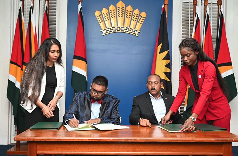 President, Dr Irfaan Ali and Antigua and Barbuda Prime Minister Gaston Browne at the signing of the Memorandum of Understanding (MoU) at State House on Friday (Office of the President photo) 