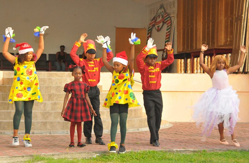 Children perform at the Rotaract Club of Georgetown annual Christmas
cheer at the Indian Monument Gardens on Saturday (Adrian Narine photo)