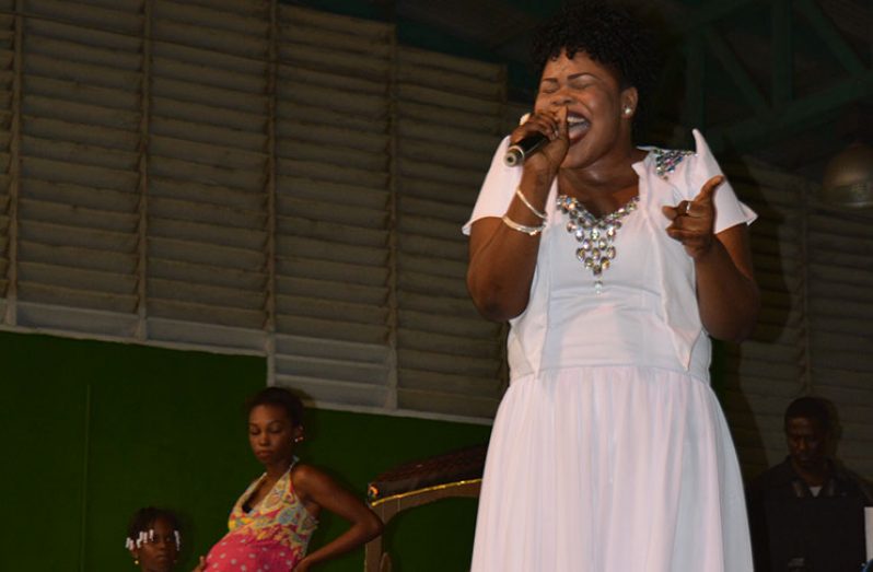 Tshanna Cort belting out
her winning song “Where
the Innocence Gone” at the
Cliff Anderson Sports Hall
Saturday night