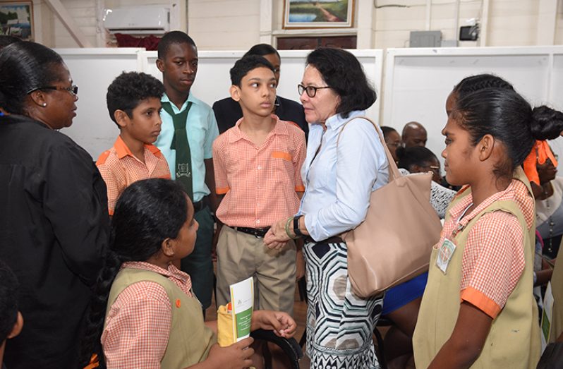 First Lady Mrs. Sandra Granger interacts with teachers and pupils of the F. E. Pollard Primary School during the launch of the
‘National Policy for the Reintegration of Adolescent Mothers in the Formal Education System’ (Samuel Maughn photo)