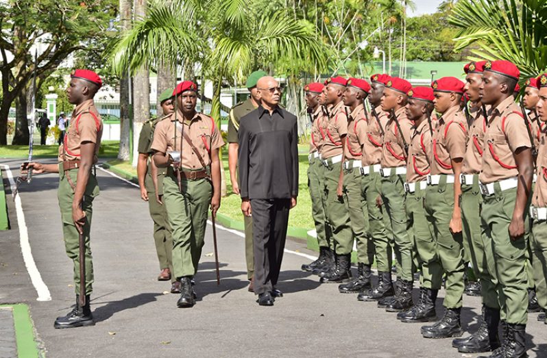 President David Granger inspects a Guard of Honour Thursday morning at the opening of the Guyana Defence Force’s Annual Officers’ Conference, held at the Baridi Benab, State House