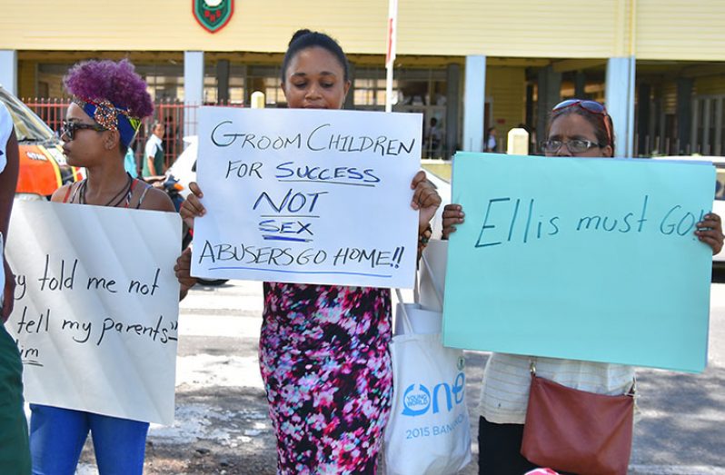 Activists protesting in front of the Bishops’ High School following sexual abuse allegations against a teacher and
comments made by the school’s Principal, Winifred Ellis (Samuel Maughn photo)