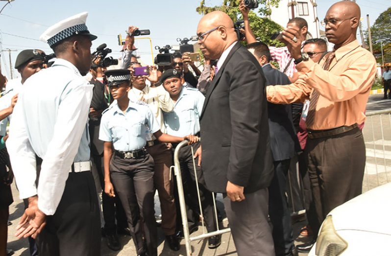 Stand back! Police threw up barricades to prevent suspended Member of Parliament Juan Edghill from entering the compound
on Tuesday (Adrian Narine photo)