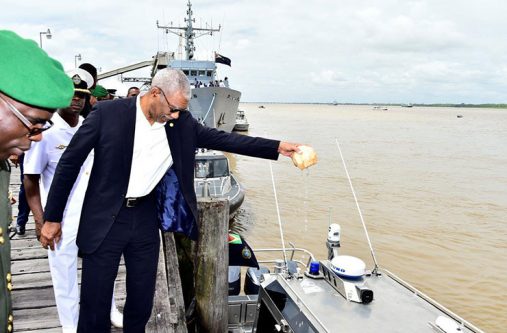 Commander-in-Chief of the Armed Forces of Guyana,
President David Granger ceremonially commissions the
vessels at the Coast Guard Headquarters by pouring
coconut water on one of them