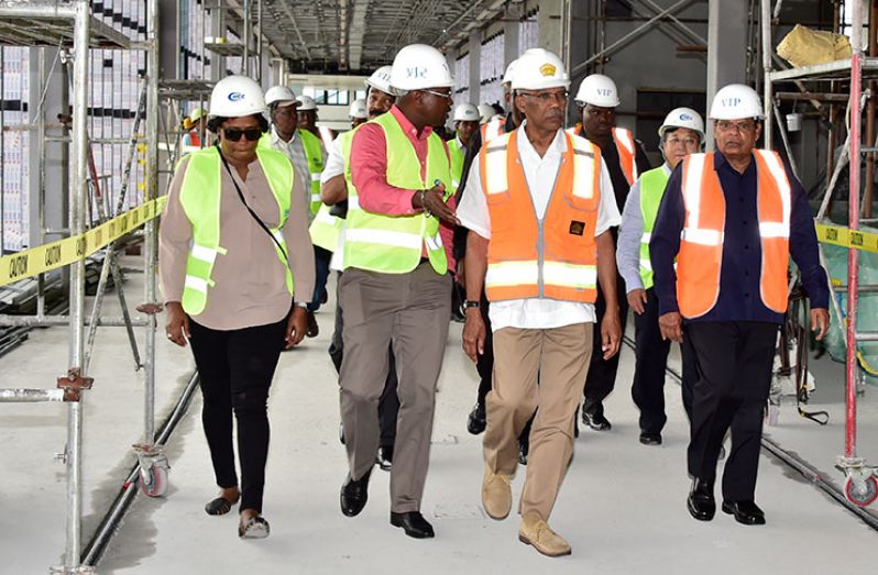 President David Granger and Prime Minister Moses Nagamootoo being escorted during a tour by Cabinet members of the Cheddi Jagan
International Airport on Saturday to inspect ongoing expansion works there. With them are Senior and Junior Ministers of Public
Infrastructure, David Patterson and Annette Ferguson , first and second left respectively (Ministry of the Presidency photo)