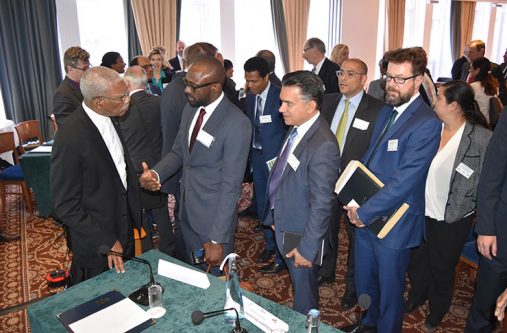 front-pic UK investors queued up to speak one-on-one with President David Granger, following the formal presentations. Here the Head of State is pictured in discussion
with Director at ION Geophysical, Mr. Folarin Lajumoke.( Ministry of the Presidency photo)