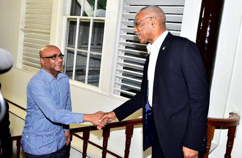 [File photo] - President David Granger greets Opposition Leader, Mr. Bharrat Jagdeo