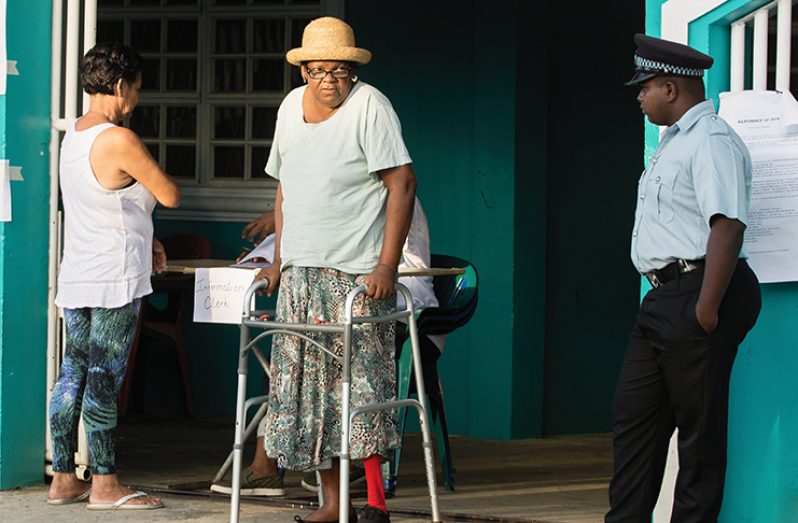 An elderly voter defied all odds to cast her ballot at a polling station on the East Coast Demerara
during Monday’s Local Government Elections (Samuel Maughn photo)