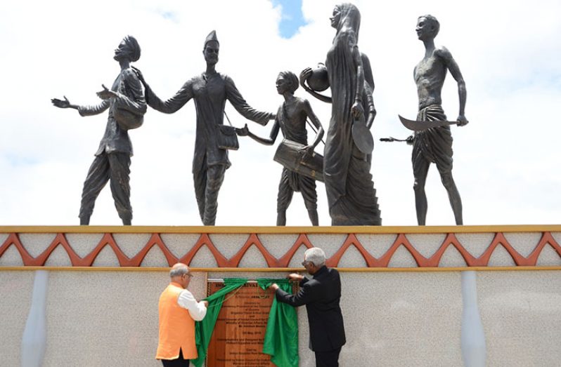 President David Granger
and Director-General of the
Indian Council for Cultural
Relations (ICCR) Akhilesh
Mishra unveil a plaque at
the commissioning of the
historic Indian Arrival Monument
at Palmyra Village, East
Berbice on Sunday (Samuel
Maughn photo)