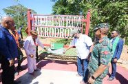 President Ali and the wife of the late Brigadier Gary Beaton, Dr. Jennifer Westford, unveil a plaque to officially open the airstrip that was named after him. The late serviceman was one of five persons killed in a horrific helicopter crash last year (Office of the President photo)