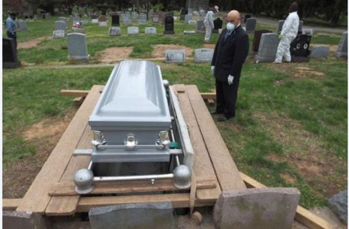 Macon Cotton, funeral director of Cotton’s Funeral Home, pays his respect to the late Peter Cave (NJ Advance Media photo)