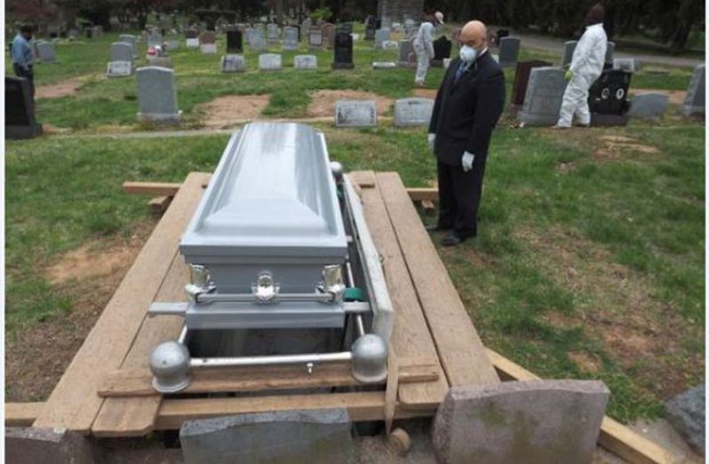 Macon Cotton, funeral director of Cotton’s Funeral Home, pays his respect to the late Peter Cave (NJ Advance Media photo)