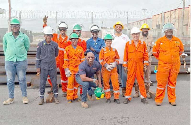 GAIMMS CEO Derek Cardinez (centre) and team with workshop apprentices at its Houston Commercial Complex Office