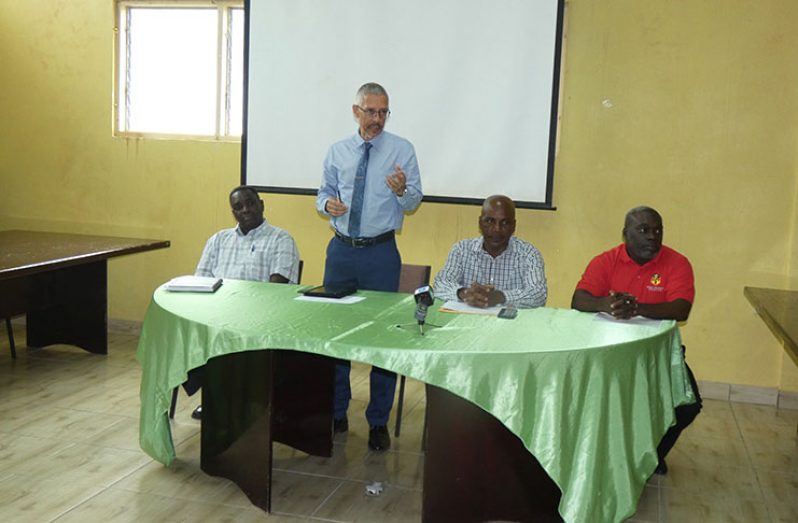 Minister Dominic Gaskin addressing the gathering of Linden investors. Also at the head-table is LCC President, Victor Fernandes (second right); SBB Linden executive Staydon Payne (right) and SBB Chief Executive Officer,Dr Lowell Porter