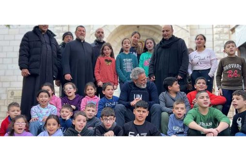 UN Resident and Humanitarian Coordinator for the occupied Palestinian territory Muhannad Hadi (sitting in the middle) visits the Latin Holy Family Church in Gaza City (UN News)