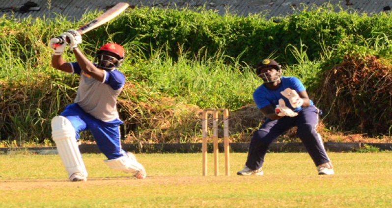Raymon Reifer lunges to record a maximum against Malteenoes Sports Club. (Adrian Narine photo)