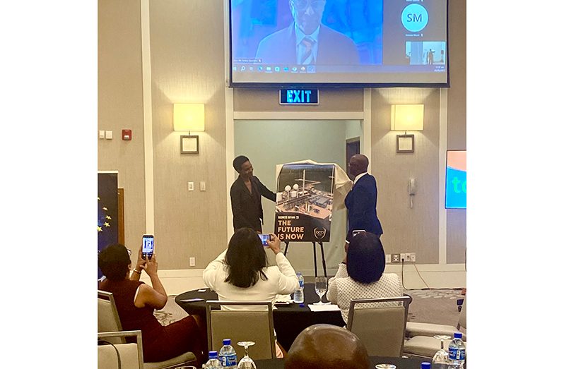 Director of External Trade at the CARICOM Secretariat, Dr. Chantal Ononaiwu (left) and President of the GCCI Kester Hutson (right) unveiling the 13th edition of GCCI’s business magazine