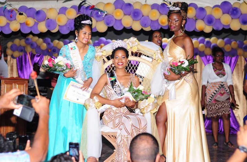 Aaliyah Anthony smiles brightly after being crowned Ms. Lethem Town Week. She is flanked by the first and second runners-up, Azeema Xavier, right, and Narissa Torres, left. (Delano Williams photo)