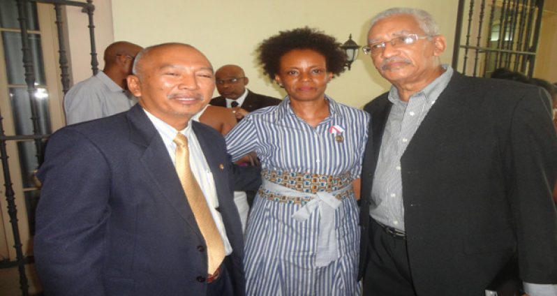 Mrs. Jasmine Thomas-Girvan with Guyana's Dr. Mark Kirton (right) and Suriname's Mr. Ruben Martoredjo of the Institute of International Relations (IIR) at the University of the West Indies just after receiving the award on behalf of her late husband.