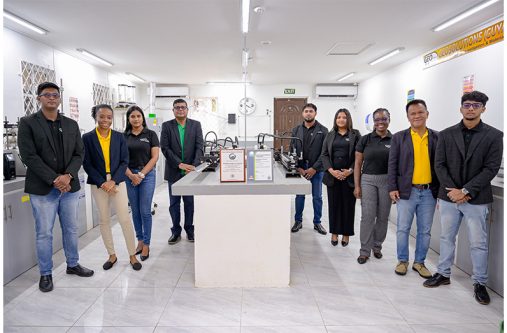 Management and staff of newly certified Geo-Solutions proudly pose with the GNBS certificate and plaque