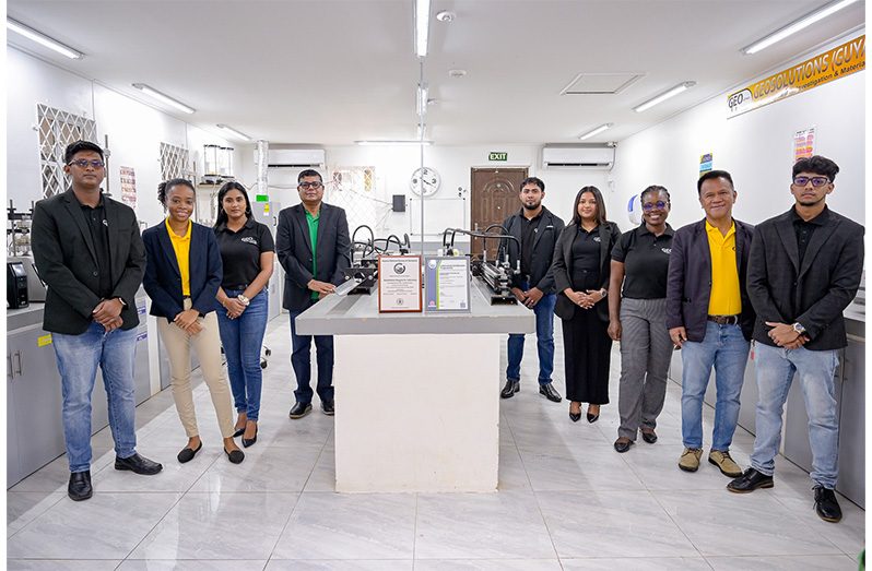 Management and staff of newly certified Geo-Solutions proudly pose with the GNBS certificate and plaque
