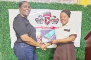 Winners of the GNNL Christmas Giveaway collecting their prizes during a simple ceremony held at the company’s Lama Avenue, Georgetown office