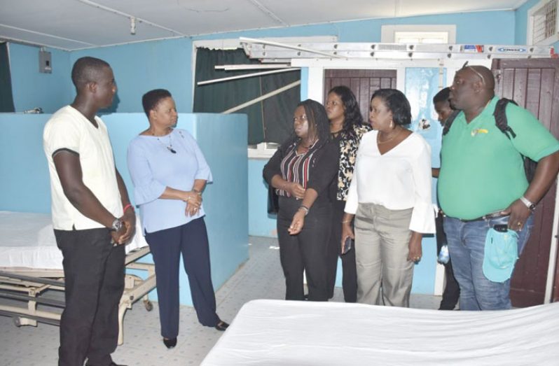Community Health Worker, Kevon Joseph (extreme left), gives Ministry of Public Health team a tour of the health centre which is to be upgraded to a polyclinic.
