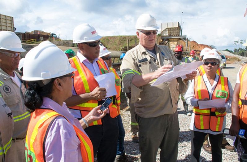 Minister of Natural Resources, Raphael Trotman (third from right) and Minister within the Ministry of Finance, Jaipaul Sharma (right) being given an overview of the Aurora Gold Mine by General Manager, Victor Rozon (second from right) during a recent visit to the company’s Aurora mines. (DPI photo)