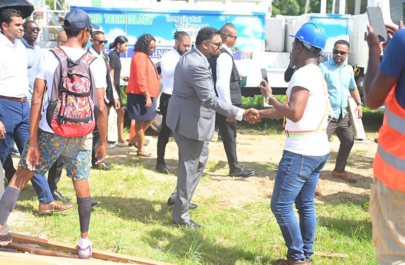 President, Dr. Irfaan Ali meeting with residents in Tucville during a walkabout in the community (Delano Williams photo)