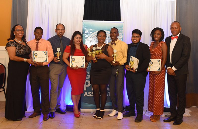 General Manager of the Guyana Chronicle, Sherod Duncan (right), and Administrative Manager Donna Todd with the Chronicle winners. From right: Lisa Hamilton, Navindra Seoraj, Samuel Maughn, Vanessa Braithwaite, Indrawattie Natram, Rabindra Rooplall and Delano Williams (Samuel Maughn photo)