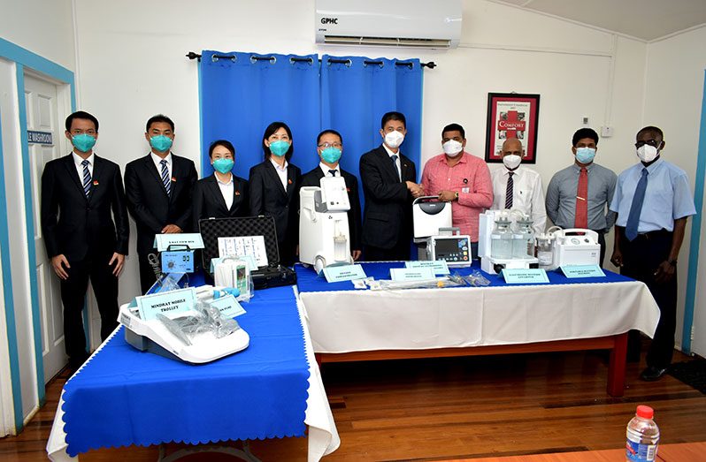 Chinese Economic and Commercial Counsellor, Hu Hanming; CEO (ag) of the Georgetown Public Hospital Corporation, Robbie Rambarran and others at the handing-over ceremony (Elvin Croker Photo)