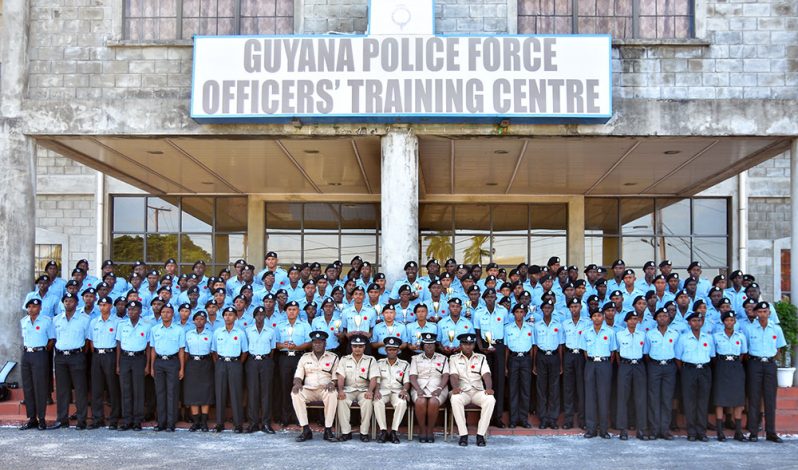 The new police officers who graduated from the Felix Austin Police College share a moment with their seniors (Samuel Maughn photo)