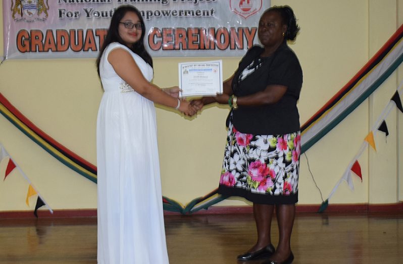One of the graduates receiving her certificate