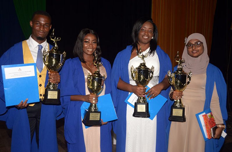 (right to left) Bibi Yassin, Valedictorian of Medical Laboratory Technicians Faculty 2015-2017; Tamra Carter, Valedictorian of Pharmacy Assistant Faculty 2017-2018; Candace Wallace, Valedictorian of Environmental Health Assistant Faculty 2017-2018; Wickliff Garnett, Valedictorian of X-Ray Technician Faculty 2017-2019