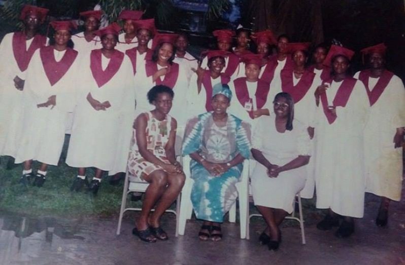 Ms Denise Gordon (seated centre) with some of her students who graduated from the institution