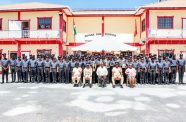 The largest and most diverse class in the history of the Guyana Fire Service pose with Minister of Home Affairs Robeson Benn and other officials following the graduation ceremony