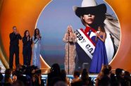 Beyoncé is joined by her daughter, Blue Ivy Carter, as she accepts the Album of the Year Grammy on Sunday, February 2 (Sonja Flemming/CBS)